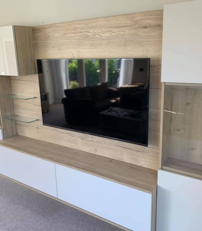 White and wood-effect fitted TV wall with display cabinets